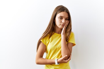 Poster - Young brunette teenager standing together over isolated background thinking looking tired and bored with depression problems with crossed arms.