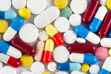 Background from colorful pills and capsules. Pharmaceutical industry concept. Pharmacy. Antibiotic resistance.