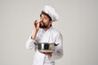 © SHOTPRIME STUDIO - emotional male chef with a saucepan in his hands cooking restaurant industry