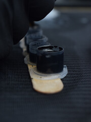 Poster - Close-up shot of small containers filled with black tattoo inks