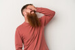 © Asier - Young caucasian ginger man with long beard isolated on white background laughs joyfully keeping hands on head. Happiness concept.