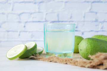 Refreshing lemon water drink on table , top view 