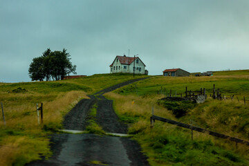 Wall Mural - beautiful view of the Icelandic landscape covered in lush green grass and dynamic skies the inspires wanderlust in every traveler.   the scenic nature view show the ecology of the  countryside  