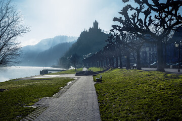 Wall Mural - Pedestrian street in Cochem with the silhouette of Cochem Castle on background - Cochem, Rhineland-Palatinate, Germany