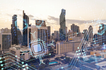 Wall Mural - Glowing hologram of technological process, aerial panoramic cityscape of Bangkok at sunset. The largest innovative hub of tech services in Southeast Asia. Multi exposure.