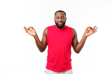 young african american sport man do meditating isolate over grey background.