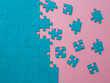 © Alexander - A set of puzzles, the process of collecting in a large pattern. Teamwork and problem solving, concept. Blue mosaic on pink
