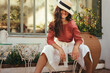 © Jacob Lund - Carefree yooung tourist woman wearing a summer hat outdoors