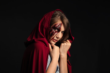 Sticker - Young woman with Halloween makeup on dark background