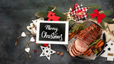 Fototapeta  - Christmas composition with baked ham.