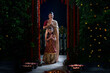 © IndiaPix - Mother and daughter greeting together with their joined hands on the occasion of Diwali