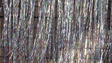 Festive Video Background. Shiny Tinsel In Silver And Red Moves And Shines, 4k.