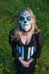 Gothic girl & thistle.
Person in a carnival mask. Mexican death mask
