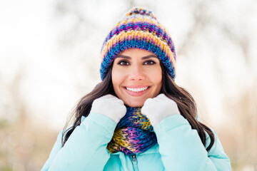 Sticker - Photo of cheerful dreamy cute lady look camera wear knitted gloves headwear scarf coat in winter park outdoors