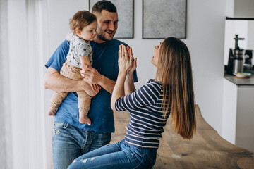 Wall Mural - Young family with their little son at home