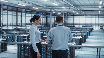 Leinwandbilder - Data Center Female System Administrator and Male IT Specialist Talk, Use Tablet Computer. Information Technology Engineers work on Cyber Security Network Protection in Cloud Computing Server Farm.