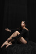 © master1305 - Portrait of young beautiful girl, modern ballet dancers posing isolated on dark background. Feelings, emotions concept