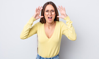 Poster - hispanic pretty woman screaming in panic or anger, shocked, terrified or furious, with hands next to head