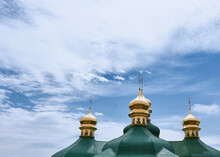 Golden Green Domes Of The Church On A Background Of Sky. 