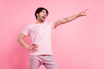 Poster - Photo portrait man wearing t-shirt spectacles relaxing at party in summer dancing happy isolated pastel pink color background