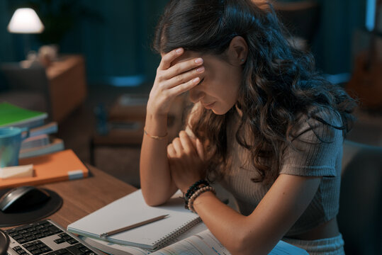 Depressed stressed woman sitting at desk