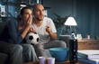 © StockPhotoPro - Soccer fans watching the match on TV