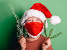 Funny Boy In Santa Claus Hat And Mask