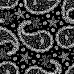 Seamless vector pattern based on traditional oriental paisley elements, Indian cucumber, buta. White pattern on a black background, suitable for textiles, fabrics, wallpapers, wrapping paper.