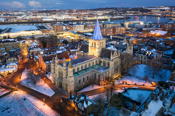 Aerial view of Rochester cathedral and snow covered historical Rochester in winter evening.