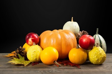 Sticker - Autumn background decoration from leaves and pumpkin on dark background.