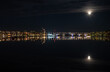 Jyväskylä city at night and full moon reflections on lake Jyväsjärvi. Finland.