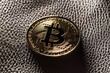 © StudioWout - Bitcoin on leather background