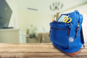 Wall Mural - Classic school backpack with different school stationery on background