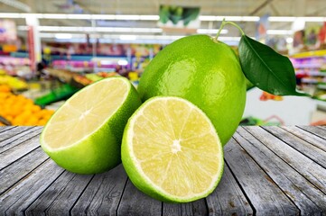 Poster - Fresh ripe juicy citrus lemon with slices and green leaf