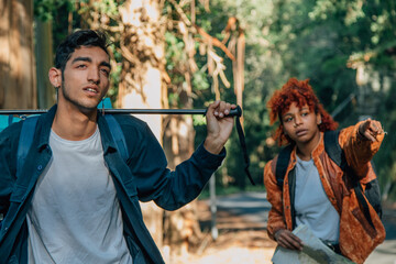 young people hiking with backpacks in nature