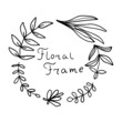 Black thin line doodle wreath of hand drawn branches and leaves isolated on white background. Floral round frame. Laurel.