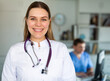 © JackF - Portrait of smiling young female doctor meeting patient in medical office