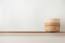 Rattan Basket By A Blank Wall Background