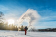 Man throwing boiling hot water freezing mid air. Or rather, the water disperse, vaporize and condensate like a cloud. Some of the water condensate freezes and forms ice crystals. Shot at -29 C or -20F