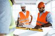© fotofabrika - Two engineers man looking at project plan on the table in construction site