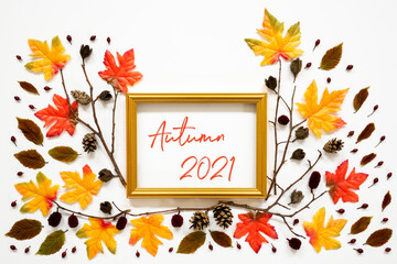 Wall Mural - colorful autumn leaf decoration, golden frame, text autumn 2021
