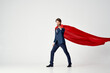 © SHOTPRIME STUDIO - business man in suit red cloak work power superman
