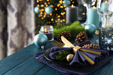 New Year table setting with bokeh on wooden table