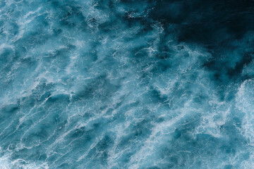  Aerial view to seething waves with foam. Waves of the sea meet each other during high tide and low tide