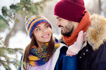 Poster - Photo of young attractive couple happy positive smile look each other enjoy time together walk forest winter