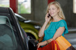 © auremar - young female shopper going inside her car