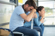 © auremar - depressed travelers waiting at train station