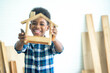 Smiling kid happy working with wood handyman creating frame comfort zone, Education, preschool and learning concept.