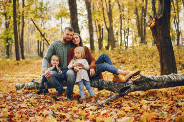 Wall Mural - Family with cute kids in a autumn park