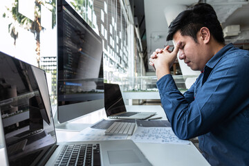 Wall Mural - man programmer stressed and headache project in software development computer in it company office, 